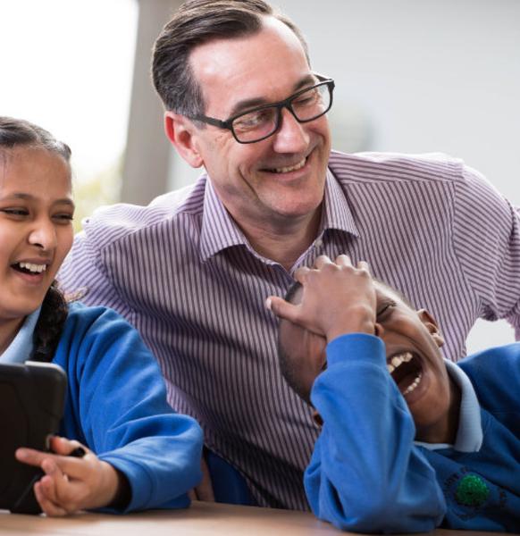 photo of teacher with 2 students